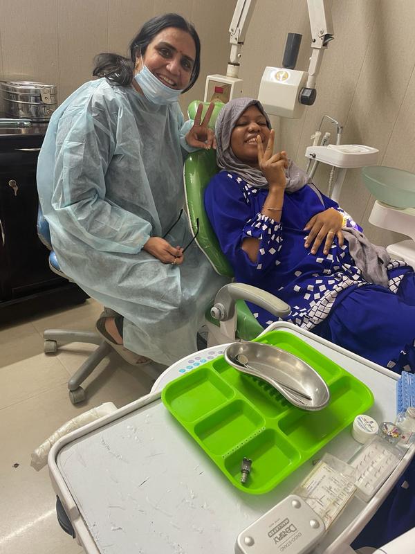Dr. Priti with a smiling patient at Madhav Dental Clinic